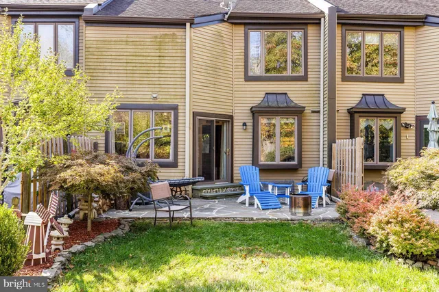 a house view with a seating space and garden