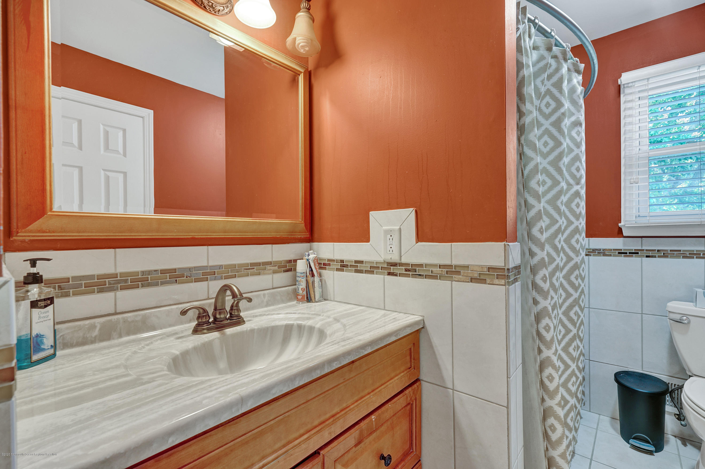 24 Andover Road Jackson, NJ 08527 - Photo 22 of 42 a bathroom with a sink and a mirror