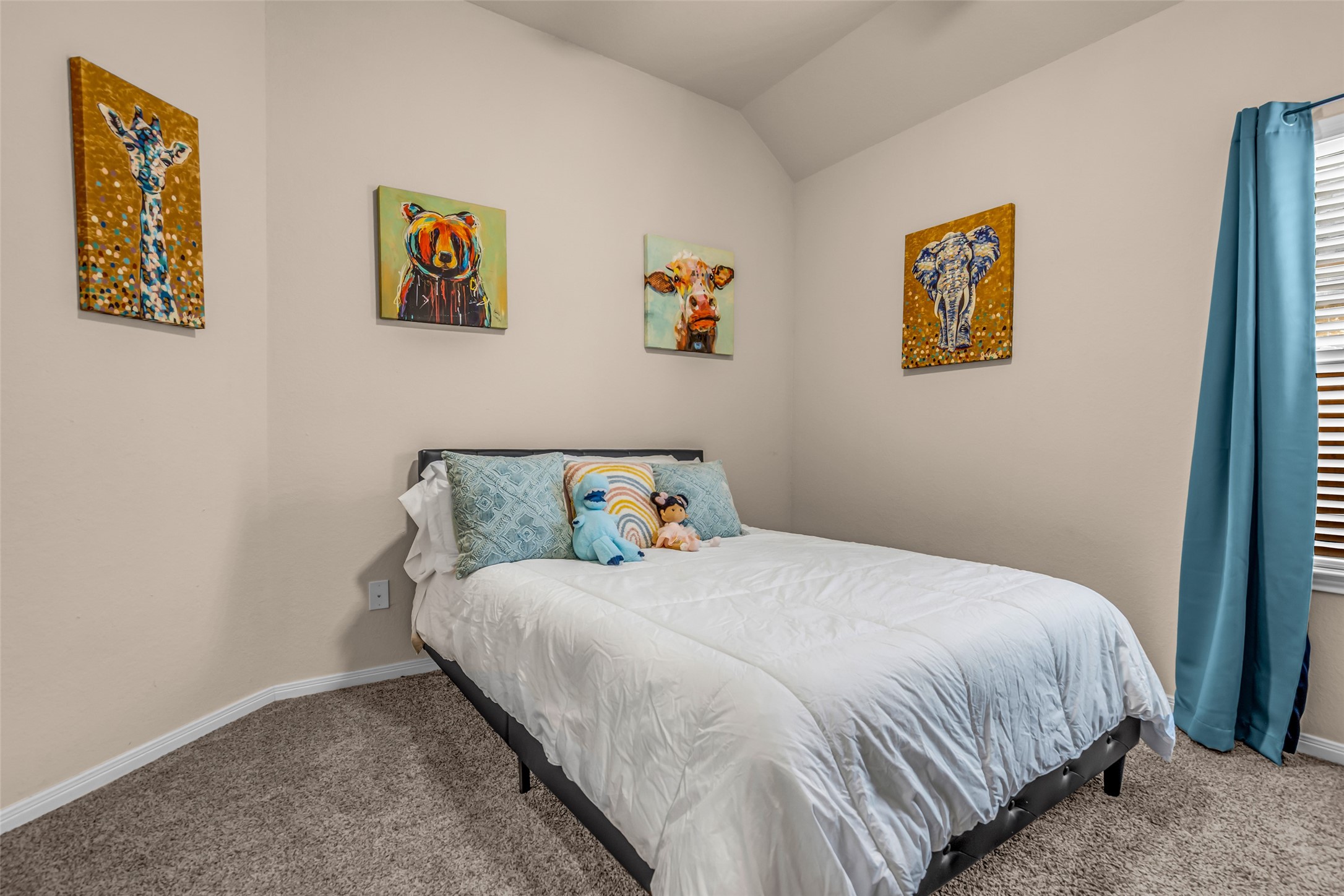 22907 Banff Brook Way Tomball, TX 77375 - Photo 16 of 26 The secondary bedroom features carpeted flooring and a window that brings in natural light while offering a pleasant view of the outdoors.