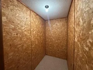 a bathroom with a shower curtain and a window