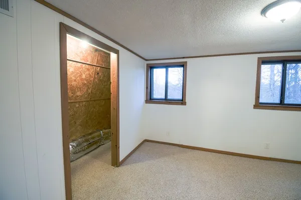 an empty room with windows