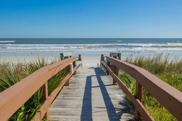 a view of a balcony with an ocean view