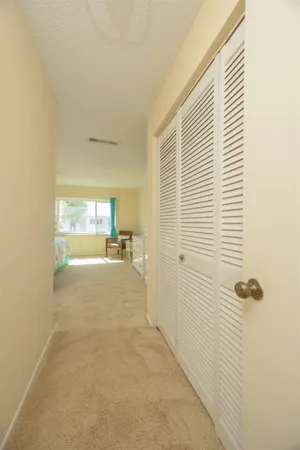 a spacious bedroom with a large bed and a window