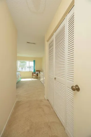 a spacious bedroom with a large bed and a window