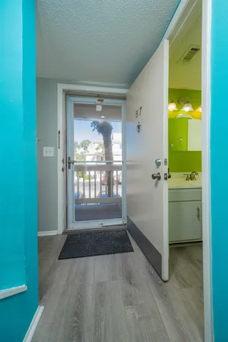 a view of a hallway with a room