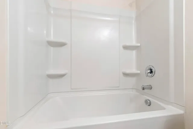 a close view of a bathtub in bathroom