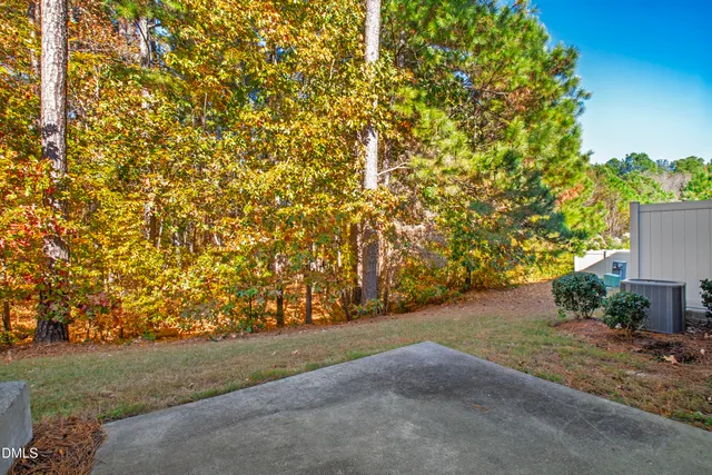 a view of a yard with an trees