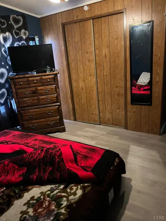 a bedroom with a bed and a mirror