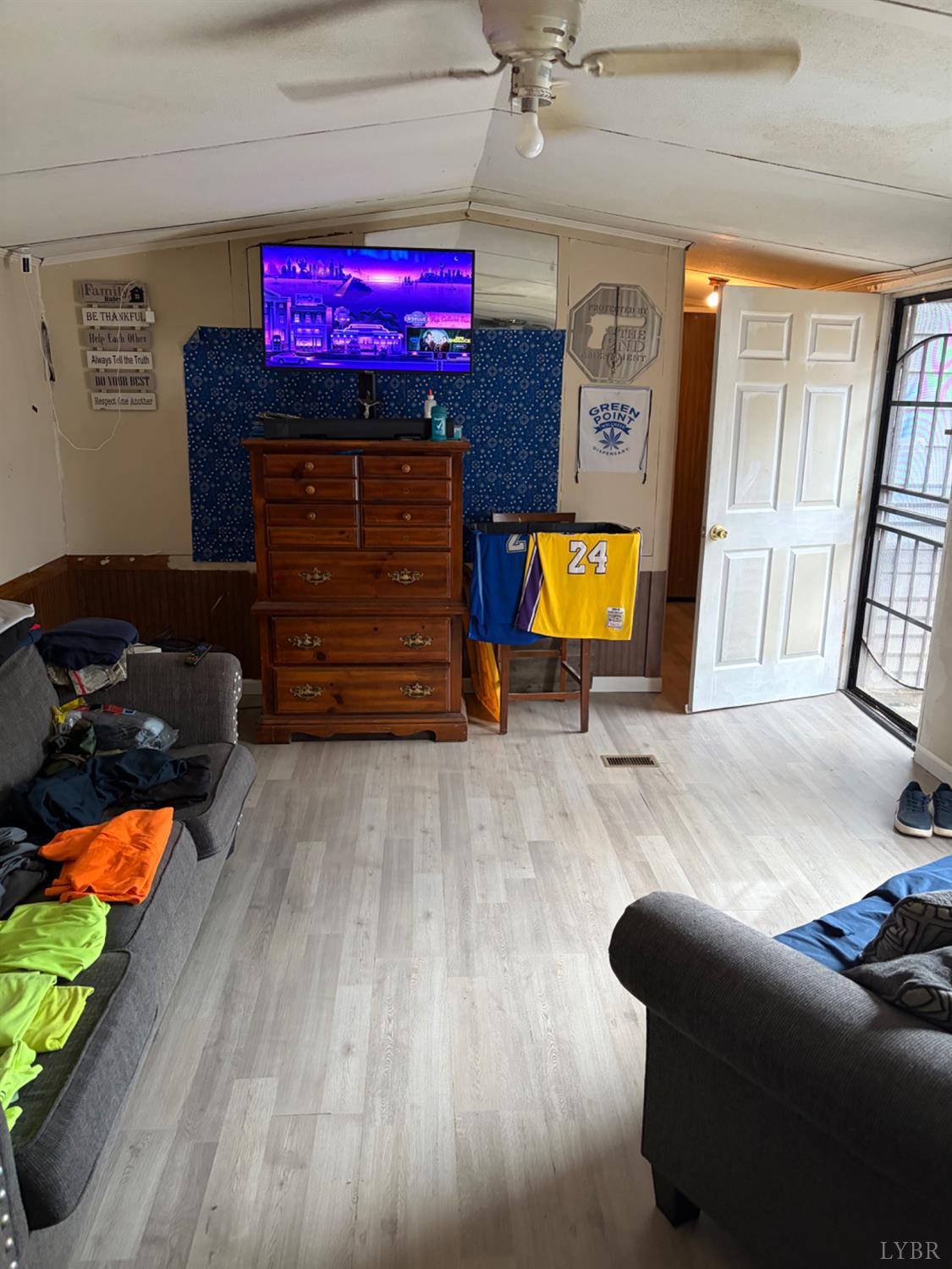 65 June Way Evington, VA 24550 - Photo 2 of 13 a living room with furniture and a flat screen tv