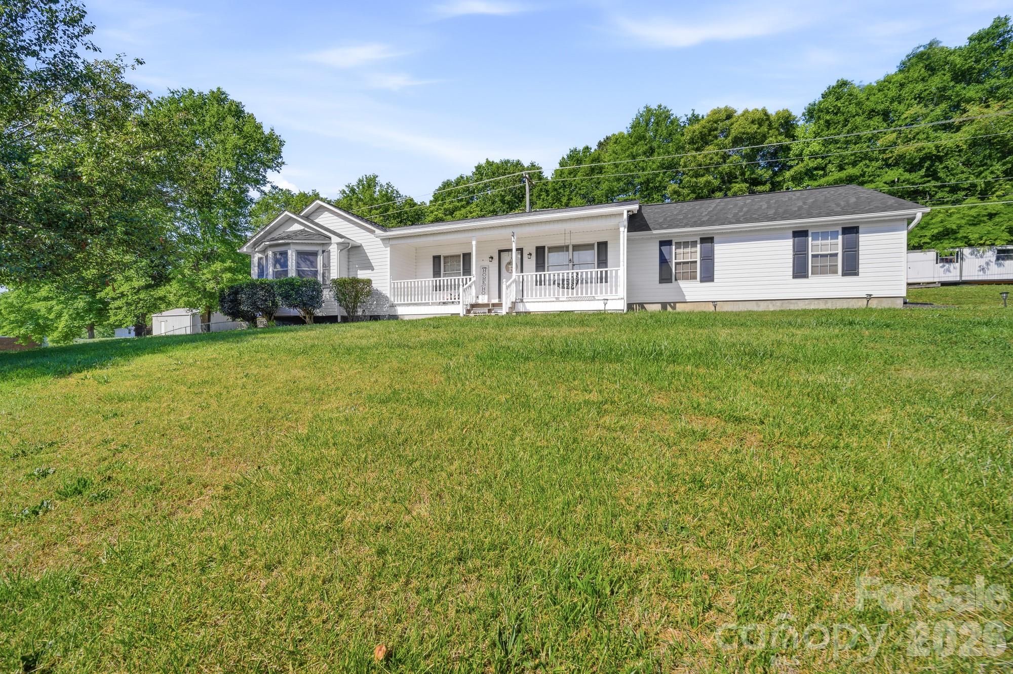 248 Jack McKinney Road Forest City, NC 28043 - Photo 3 of 29 a front view of a house with yard and green space