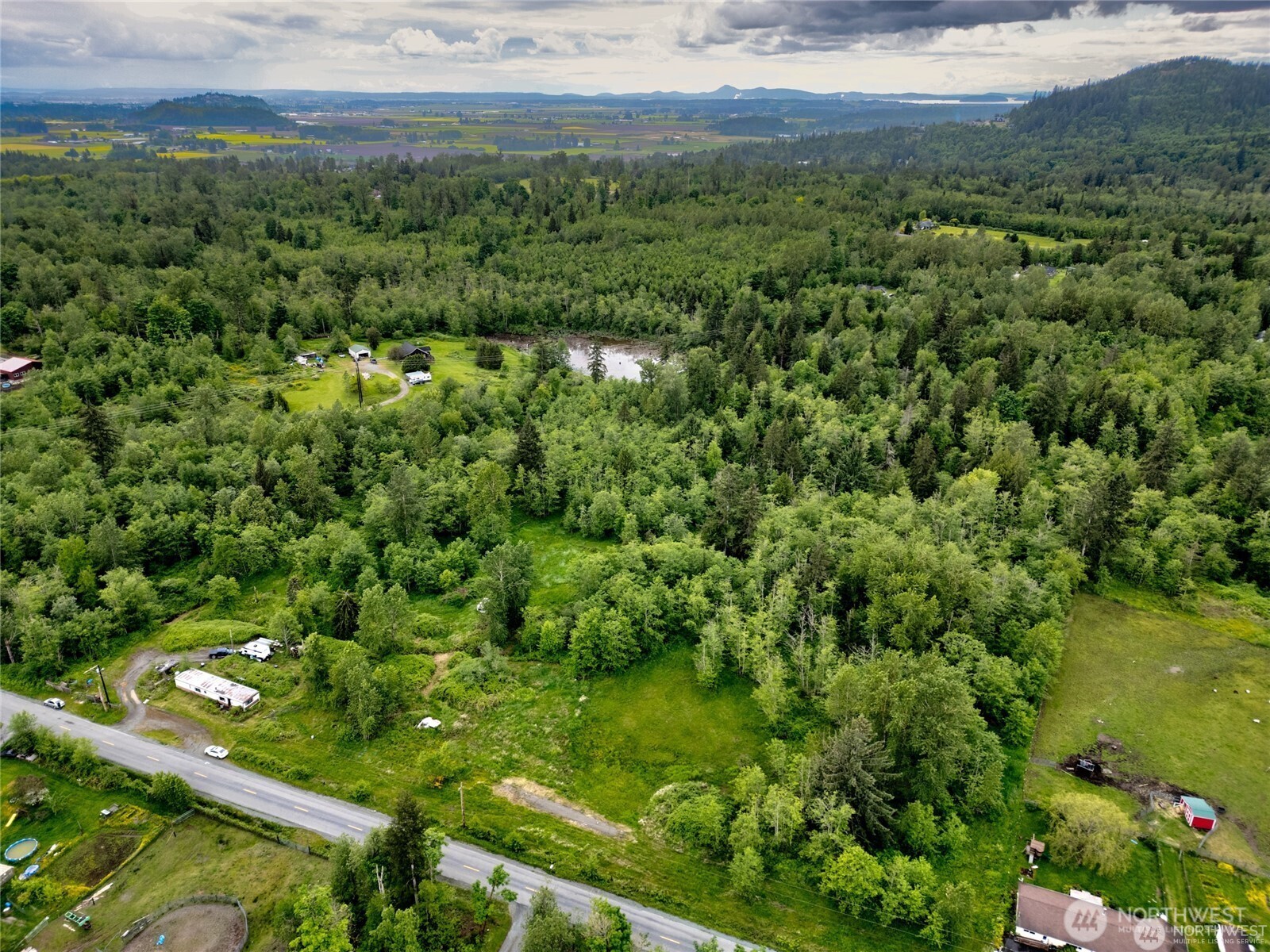 22788 Grip Road Sedro-Woolley, WA 98284 - Photo 2 of 6 a view of a green field with lots of bushes