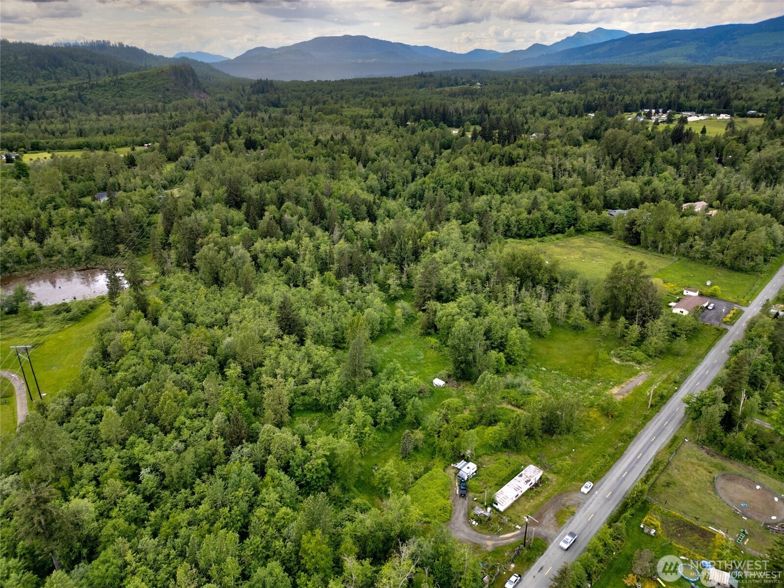 22788 Grip Road Sedro-Woolley, WA 98284 - Photo 3 of 6 a view of a lush green forest with a mountain in the background
