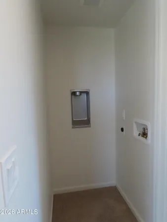 a view of a lush green hillside and a houses