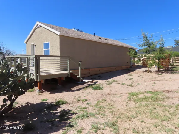 a view of a backyard of the house