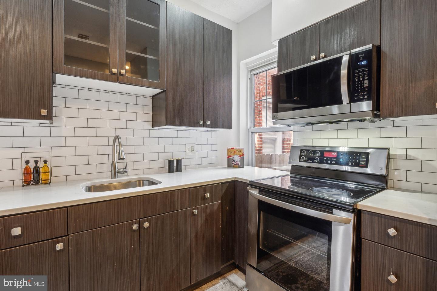1267 Morse Street Northeast Washington, DC 20002 - Photo 8 of 14 Sleek modern kitchen with stylish finishes.