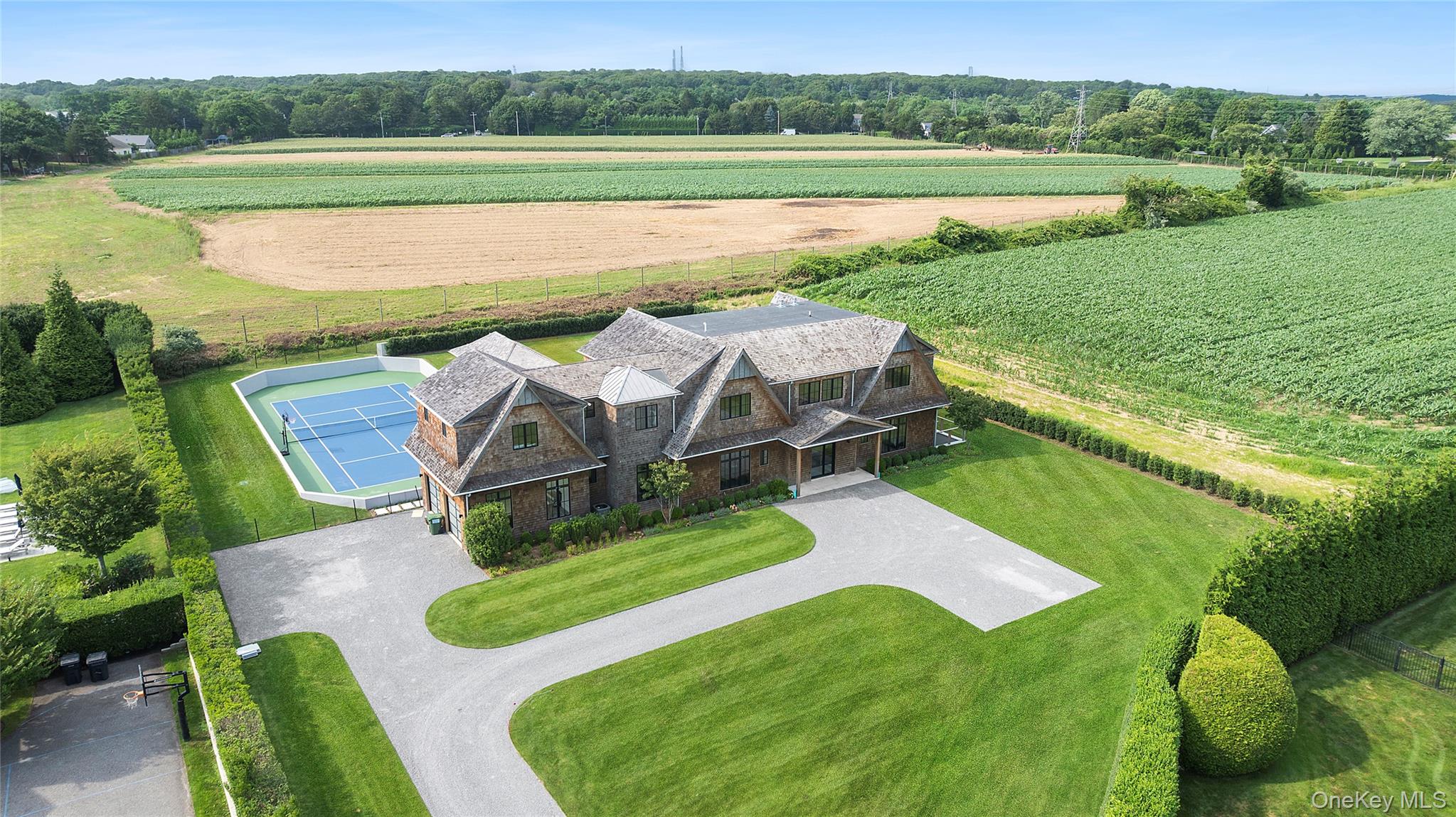 a view of a lake with a yard and outdoor seating