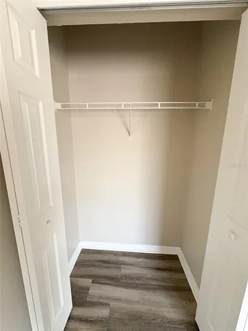 a living room with furniture and a toilet