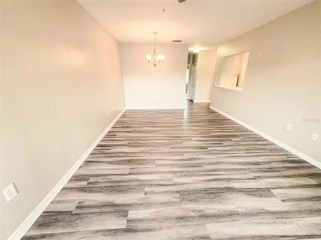 a view of a balcony with wooden floor