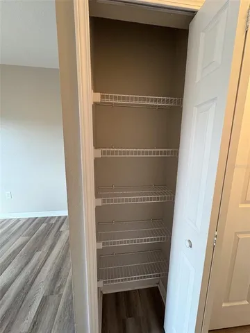 a white toilet and tub next to a shower