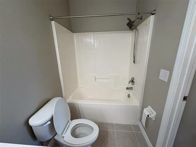 a view of a swimming pool with a lounge chair