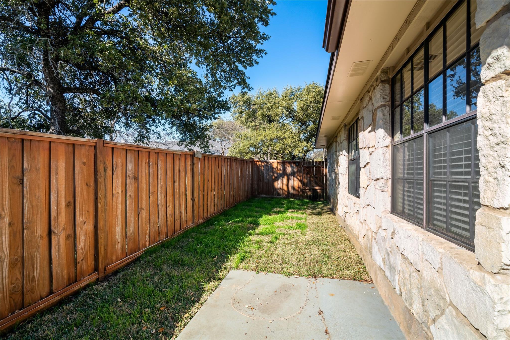3800 Foust Trail, Unit B Georgetown, TX 78628 - Photo 15 of 16 A private stone-faced residence with ample yard space and mature trees for ultimate privacy.