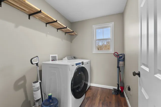 a view of a storage & utility room with a washer dryer