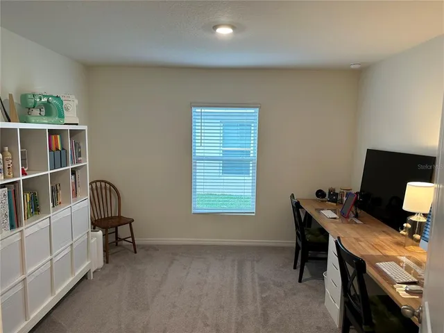 a workspace with furniture and a window