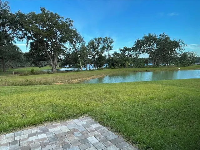 a view of a lake with a big yard