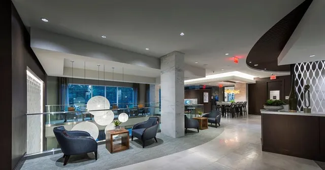 a room with gym equipment and a flat screen tv