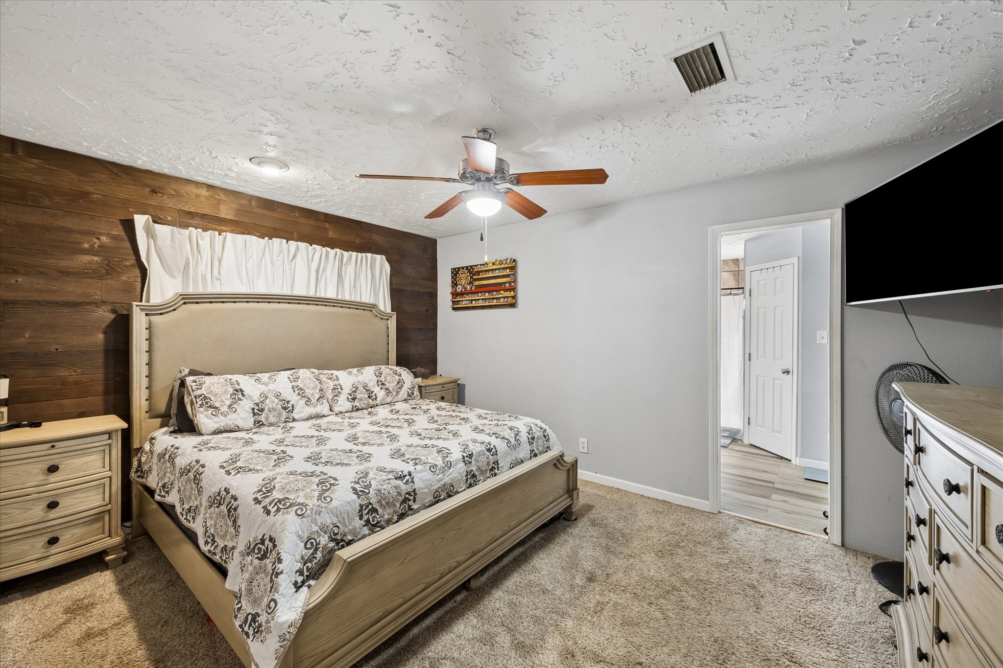 23115 Stepinwolf Lane Spring, TX 77373 - Photo 5 of 18 Primary bedroom with ample space for relaxation.