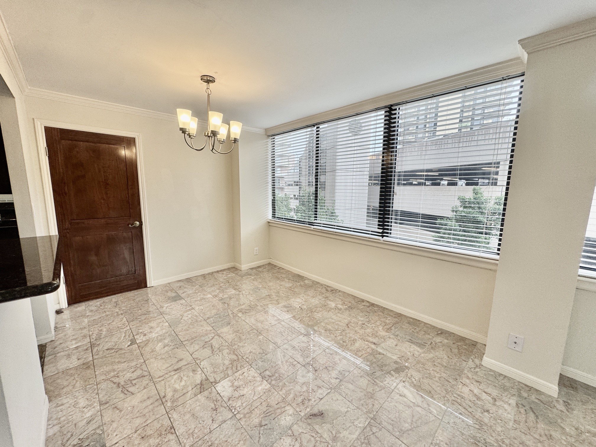 3525 Sage Road, Unit 404 Houston, TX 77056 - Photo 6 of 42 Dining area with door to primary bedroom suite in frame