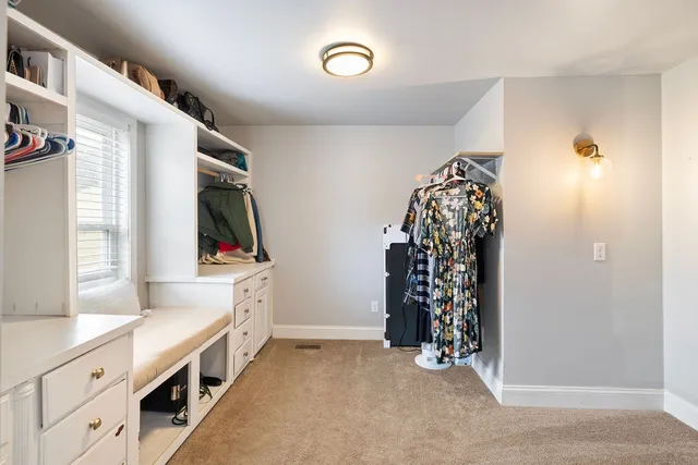 a view of an entryway with wooden floor