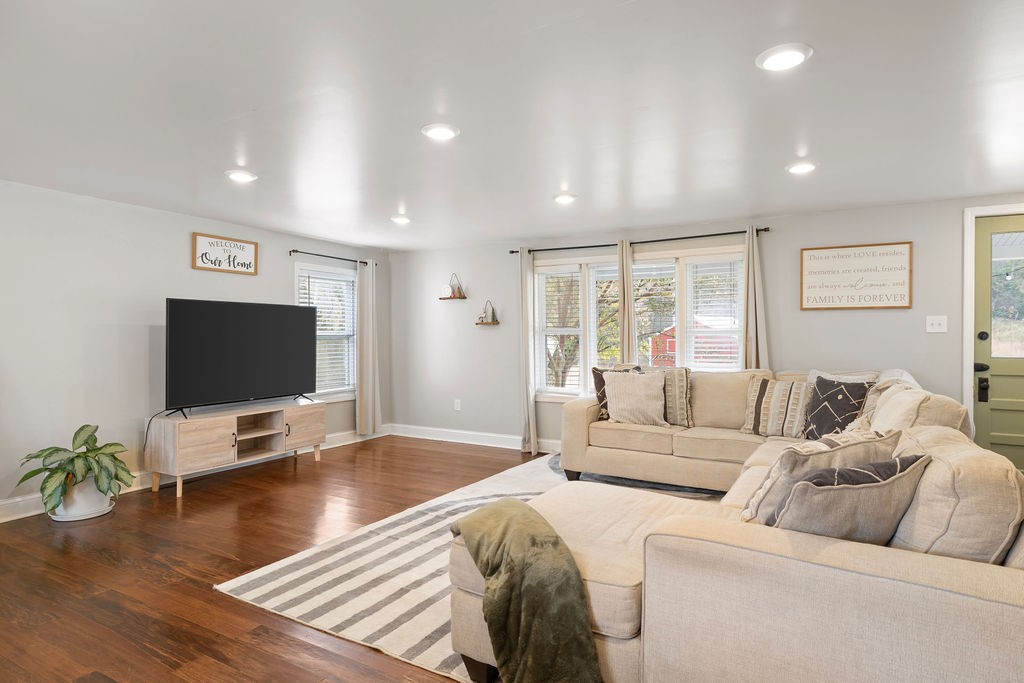 1200 Wray Branch Road Minor Hill, TN 38473 - Photo 2 of 29 a living room with furniture and a flat screen tv