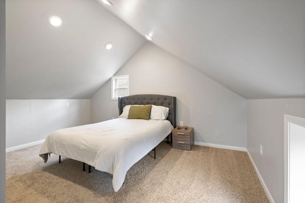 1200 Wray Branch Road Minor Hill, TN 38473 - Photo 22 of 29 a large bed sitting in a bedroom next to a window