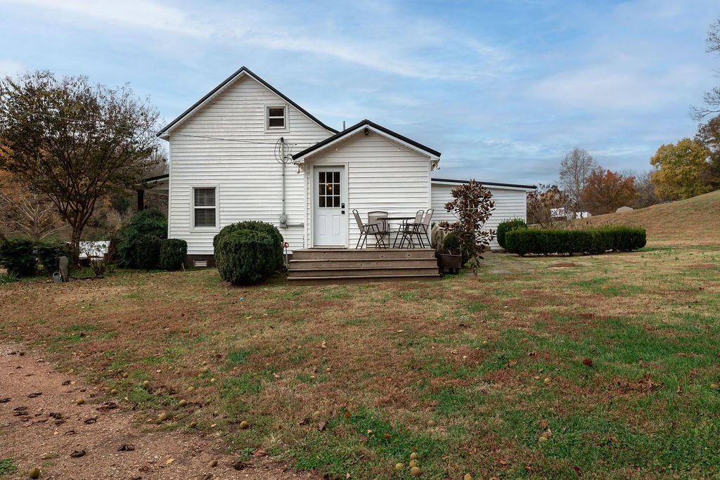 1200 Wray Branch Road Minor Hill, TN 38473 - Photo 28 of 29 a view of a house with backyard and trees