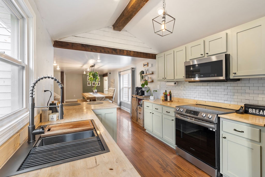 1200 Wray Branch Road Minor Hill, TN 38473 - Photo 7 of 29 a kitchen with a stove a sink and a microwave