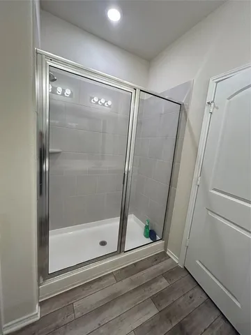 a view of an empty room with a glass door