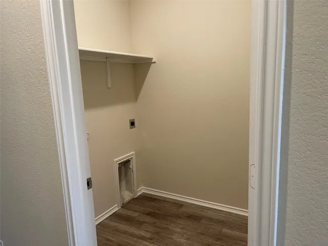 a view of hallway with wooden floor