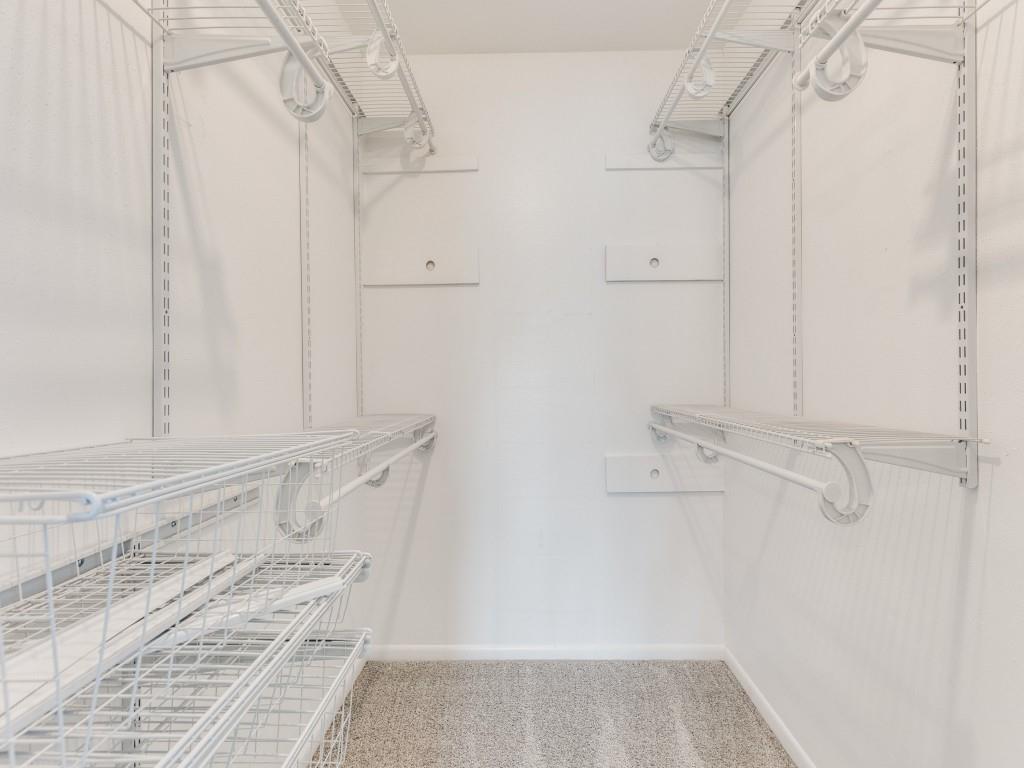 7325 Reed Road Azle, TX 76020 - Photo 25 of 38 Walk in closet featuring light carpet