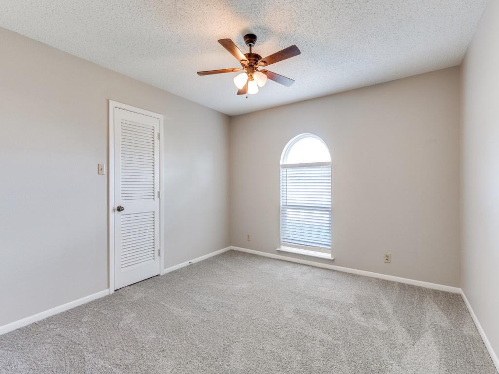 7325 Reed Road Azle, TX 76020 - Photo 28 of 38 Spare room with light carpet, a textured ceiling, and ceiling fan