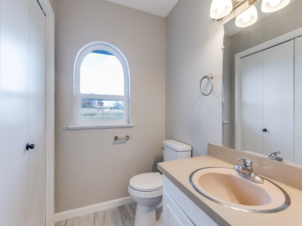 7325 Reed Road Azle, TX 76020 - Photo 31 of 38 Half bath featuring vanity and a textured wall