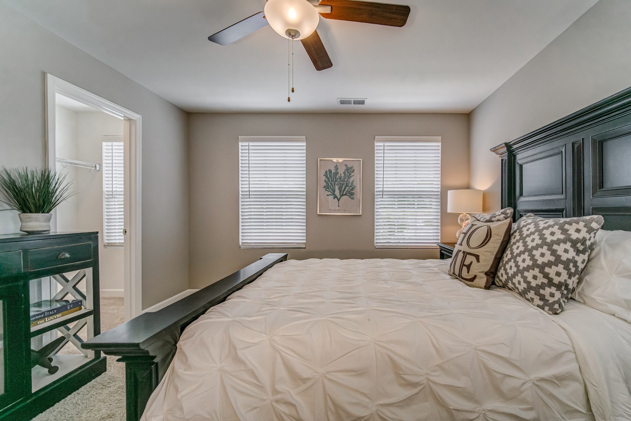 446 Withrow Way Gallatin, TN 37066 - Photo 18 of 25 a bedroom with a large bed and a chandelier
