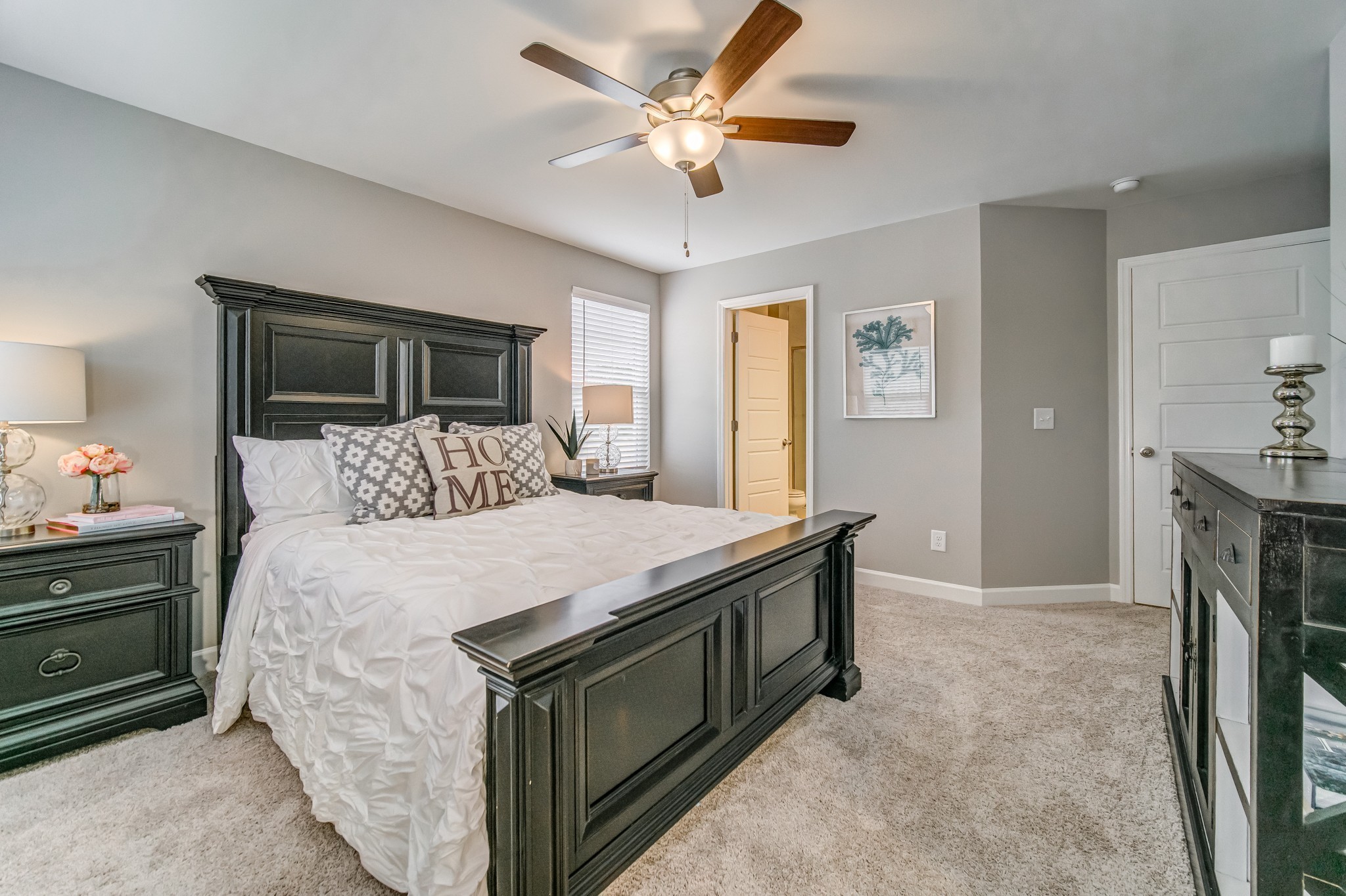 446 Withrow Way Gallatin, TN 37066 - Photo 19 of 25 a bedroom with a bed and a chandelier