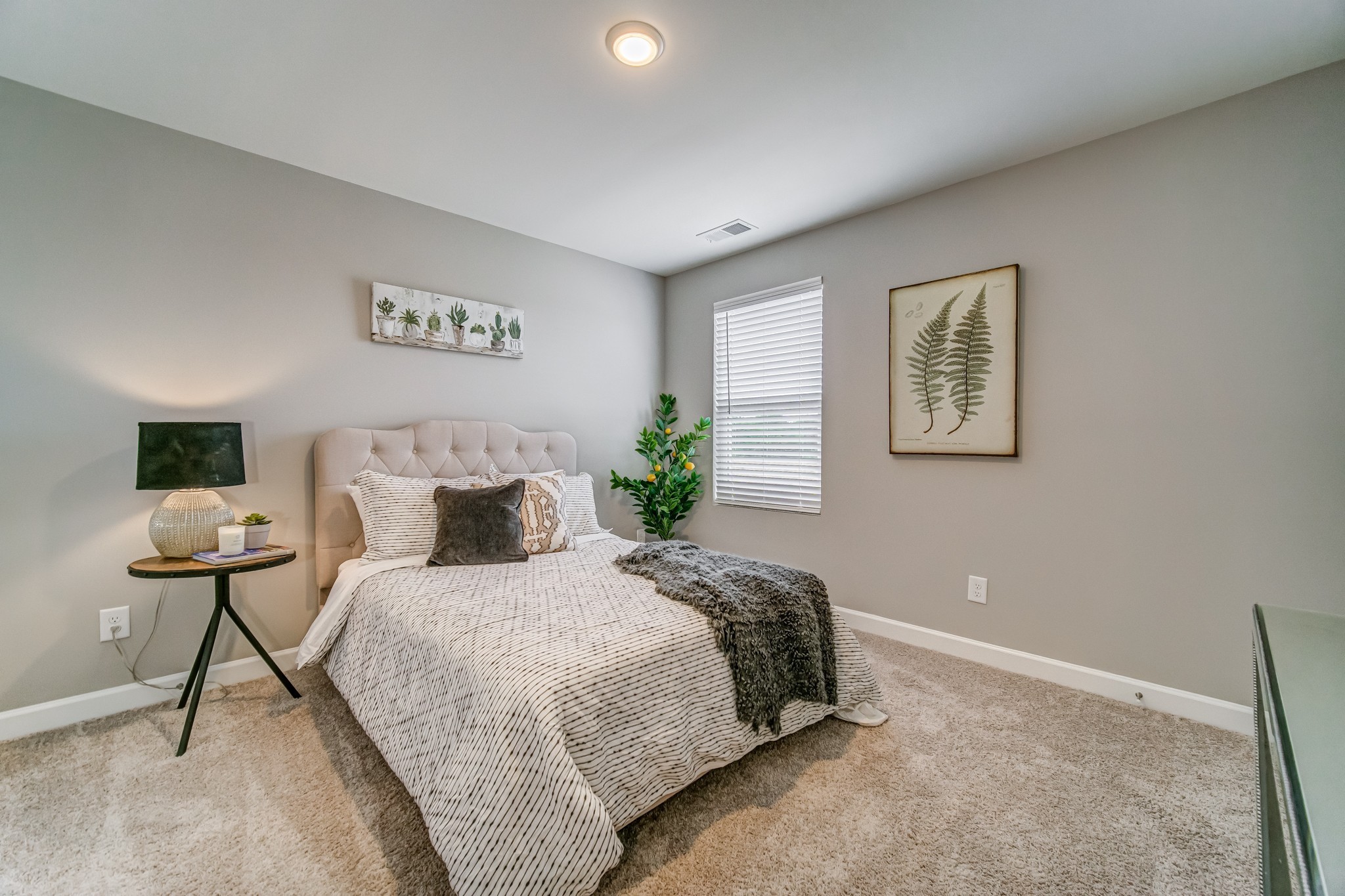 446 Withrow Way Gallatin, TN 37066 - Photo 21 of 25 a bedroom with a bed and a painting on the wall