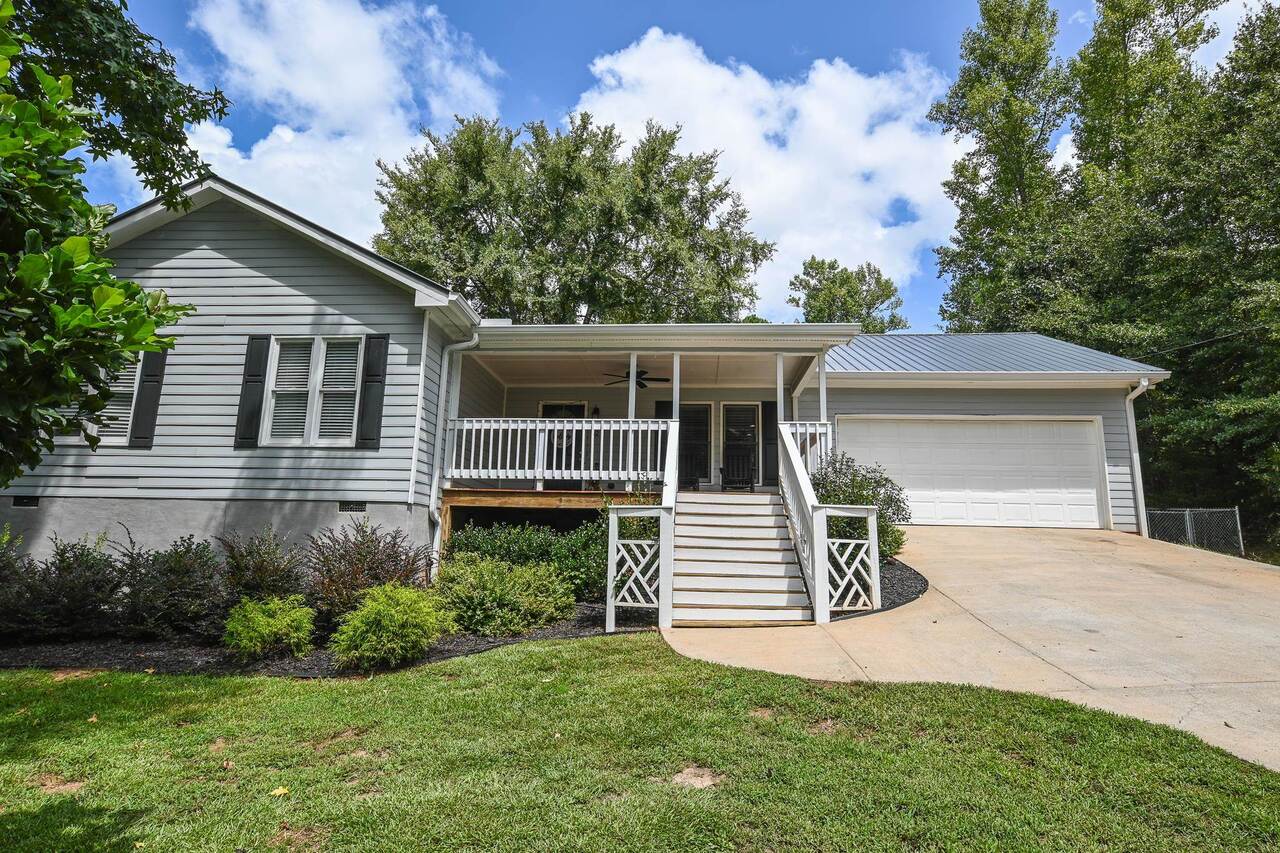 82 Post Oak Circle Crawford, GA 30630 - Photo 1 of 1 a front view of a house with a yard