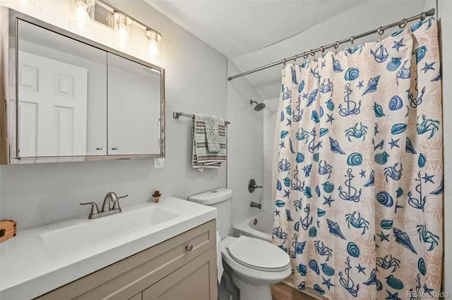 a view of bathroom with a sink toilet and shower