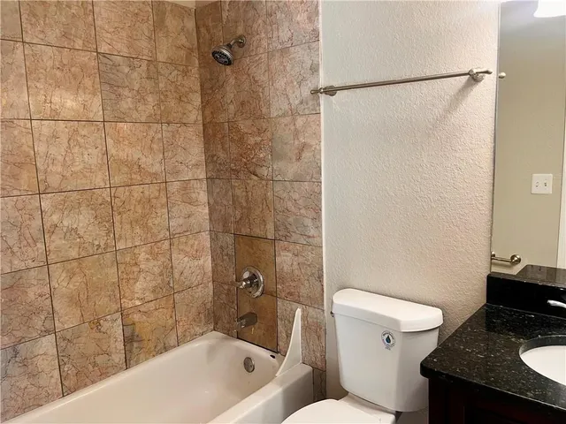 a bathroom with a sink and a toilet