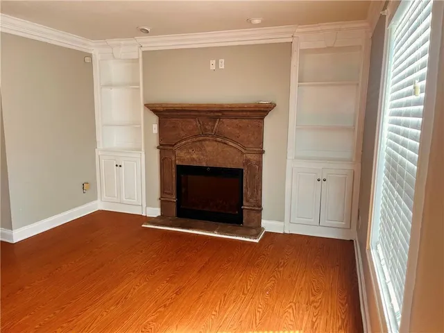 a view of empty room with a fireplace