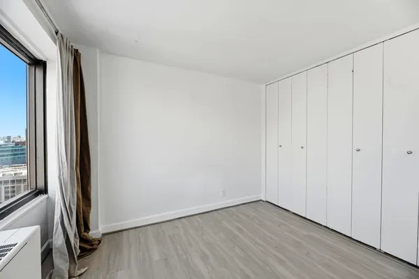a bathroom with a toilet sink and shower curtain