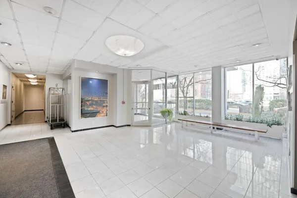 a kitchen with stainless steel appliances a stove top oven a sink a counter space and cabinets